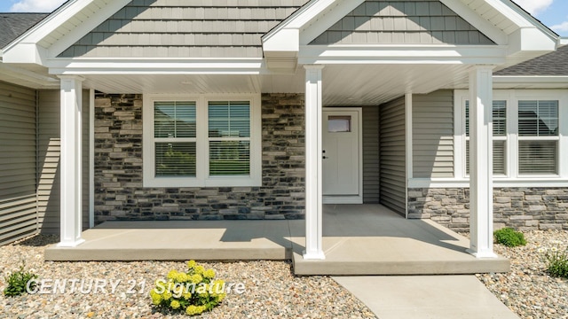 10464 Laurel Woods Pl, Freeland, MI 48623 - property entrance featuring covered porch and stone siding
