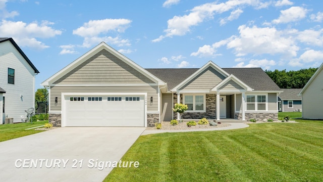 10464 Laurel Woods Pl, Freeland, MI 48623 - craftsman-style home with stone siding, a garage, driveway, and a front yard