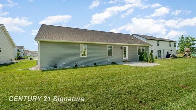 10464 Laurel Woods Pl, Freeland, MI 48623 - back of house with a patio area, a yard, and a playground