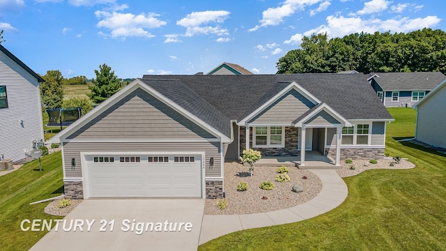 10464 Laurel Woods Pl, Freeland, MI 48623 - craftsman-style home featuring stone siding, driveway, an attached garage, and a front yard