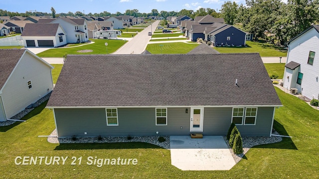 10464 Laurel Woods Pl, Freeland, MI 48623 - view of front of house featuring a residential view, a patio, a front lawn, and roof with shingles