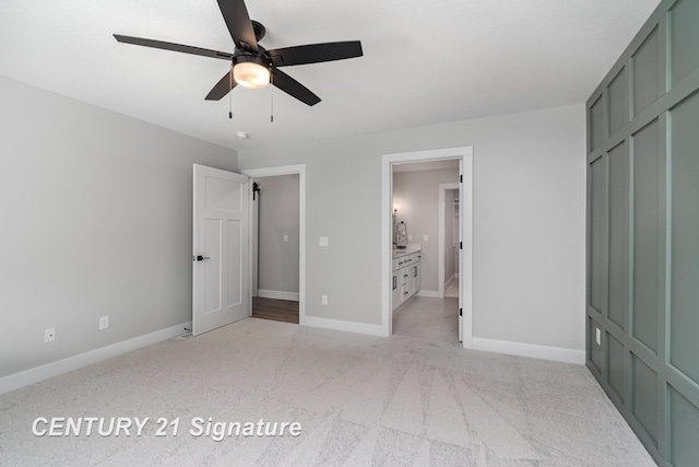 10464 Laurel Woods Pl, Freeland, MI 48623 - unfurnished bedroom featuring light colored carpet, ensuite bathroom, and ceiling fan