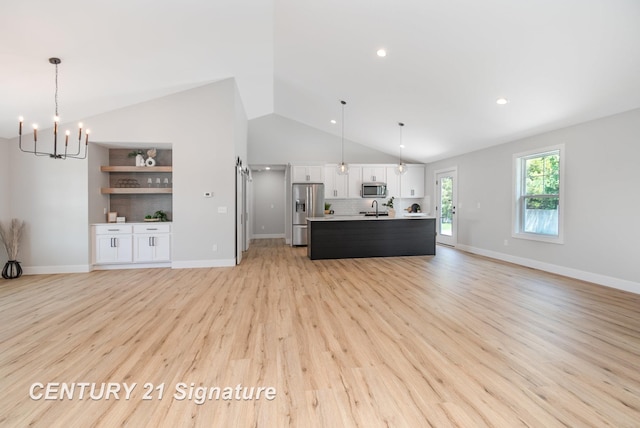 10464 Laurel Woods Pl, Freeland, MI 48623 - living room featuring lofted ceiling, a chandelier, light wood-style floors, built in features, and recessed lighting