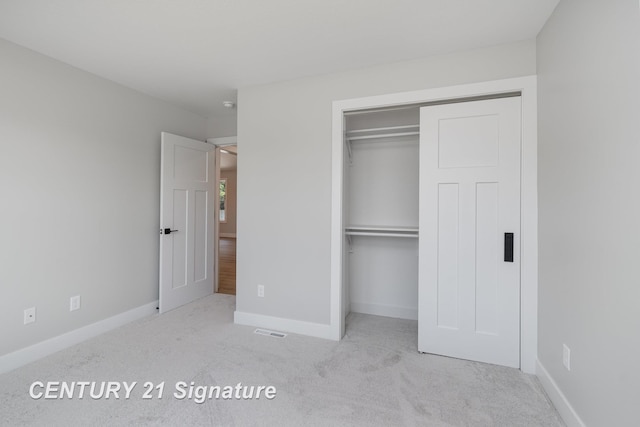 10464 Laurel Woods Pl, Freeland, MI 48623 - unfurnished bedroom featuring carpet and a closet