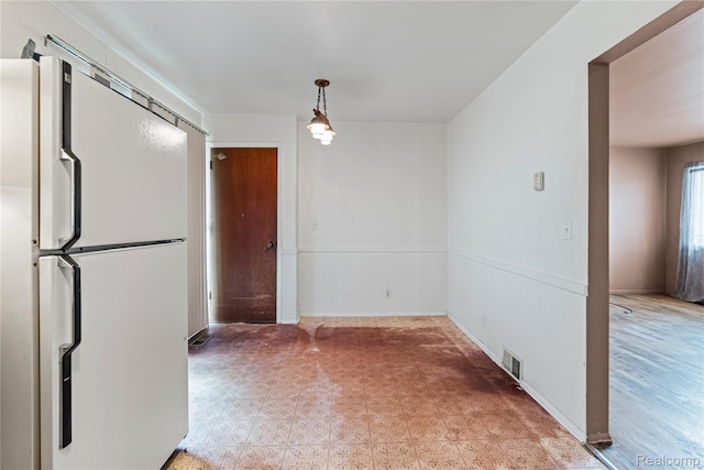 5428 Farmhill Rd, Flint, MI 48505 - unfurnished dining area featuring baseboards and light flooring