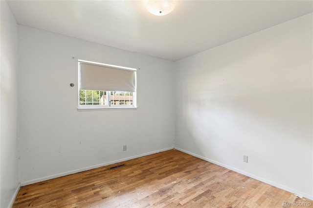 5428 Farmhill Rd, Flint, MI 48505 - spare room featuring wood finished floors and baseboards