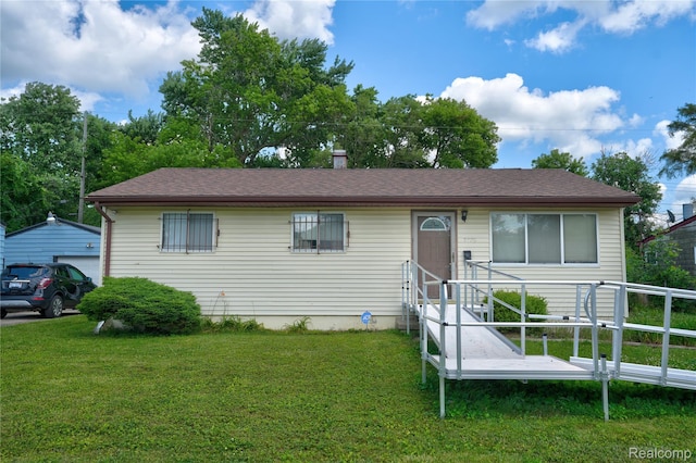 5428 Farmhill Rd, Flint, MI 48505 - single story home with entry steps, a front lawn, and a garage