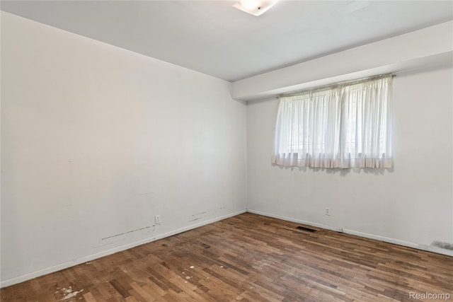 5428 Farmhill Rd, Flint, MI 48505 - spare room featuring wood finished floors