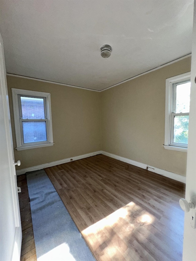 15043 Holmur St, Detroit, MI 48238 - empty room with wood finished floors and ornamental molding