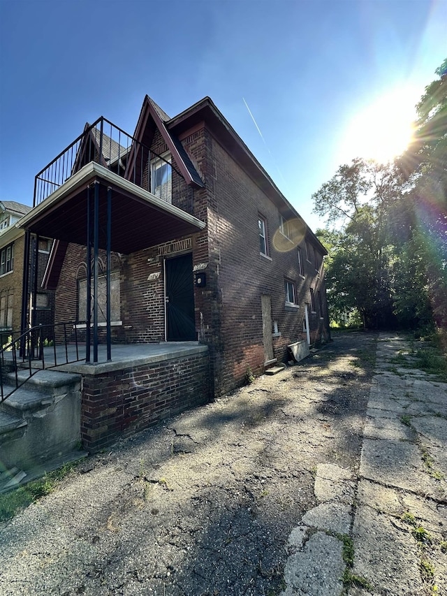 15043 Holmur St, Detroit, MI 48238 - view of side of property with a balcony and brick siding