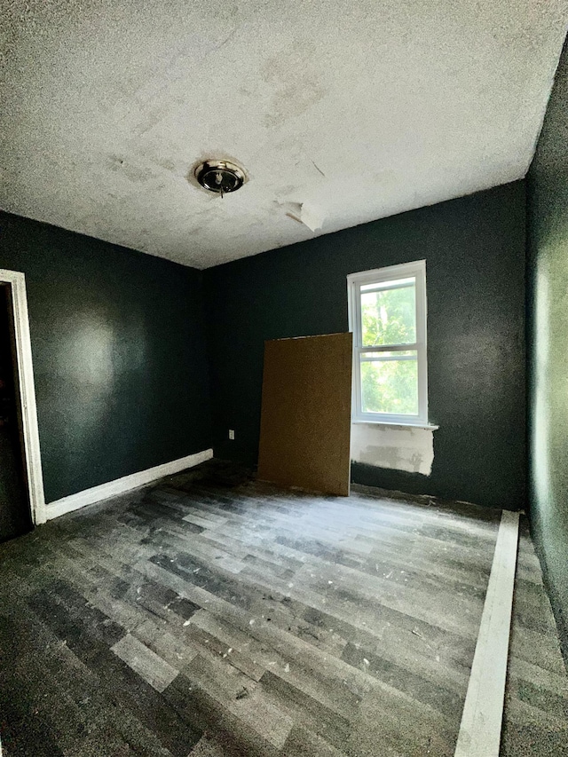 15043 Holmur St, Detroit, MI 48238 - spare room featuring a textured ceiling and wood finished floors
