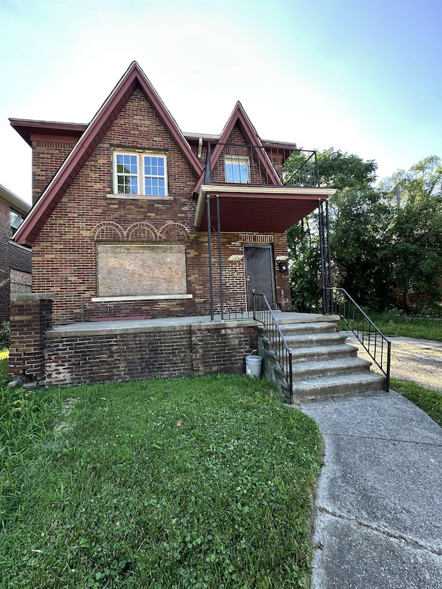 15043 Holmur St, Detroit, MI 48238 - view of front of home with brick siding and a front yard