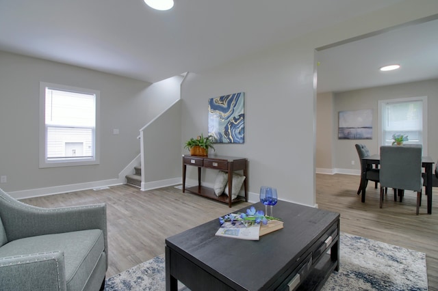 609 W Biddle St, Jackson, MI 49203 - living area with stairs and light wood-style flooring