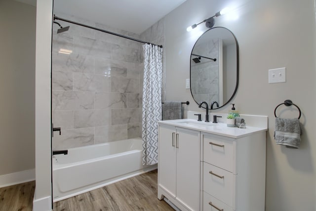 609 W Biddle St, Jackson, MI 49203 - bathroom with shower / bath combination with curtain, vanity, and wood finished floors