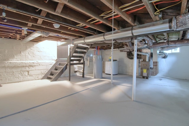 609 W Biddle St, Jackson, MI 49203 - below grade area featuring stairs, water heater, and heating unit