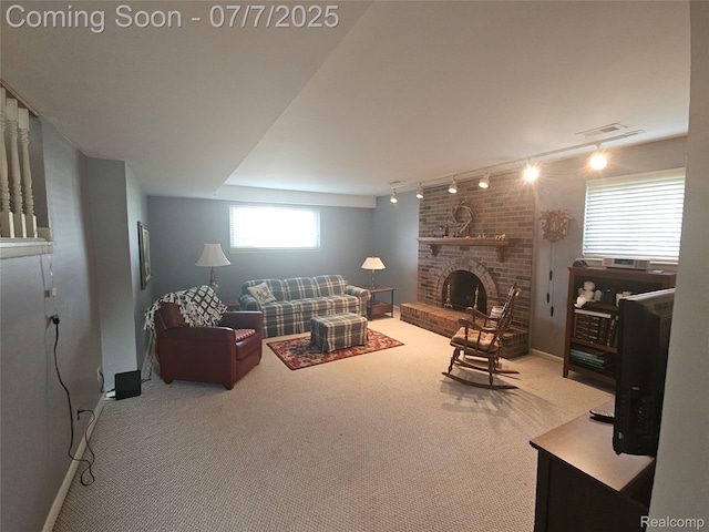 38412 Sutton Dr, Sterling Heights, MI 48310 - living area featuring carpet floors, rail lighting, and a brick fireplace