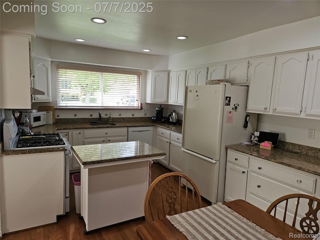 38412 Sutton Dr, Sterling Heights, MI 48310 - kitchen with white appliances, white cabinets, dark wood-style floors, recessed lighting, and extractor fan