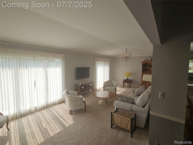 38412 Sutton Dr, Sterling Heights, MI 48310 - living room featuring a chandelier, carpet flooring, and plenty of natural light