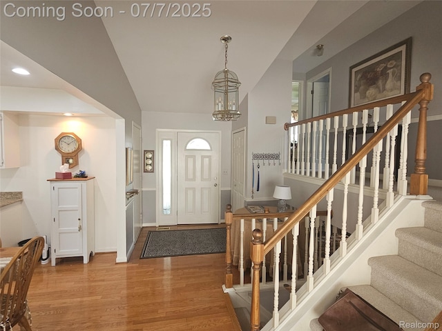 38412 Sutton Dr, Sterling Heights, MI 48310 - foyer entrance with wood finished floors, stairs, recessed lighting, and a chandelier
