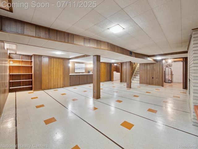 29620 Oakview St, Livonia, MI 48154 - finished below grade area featuring wood walls, washer / dryer, water heater, stairs, and tile patterned floors