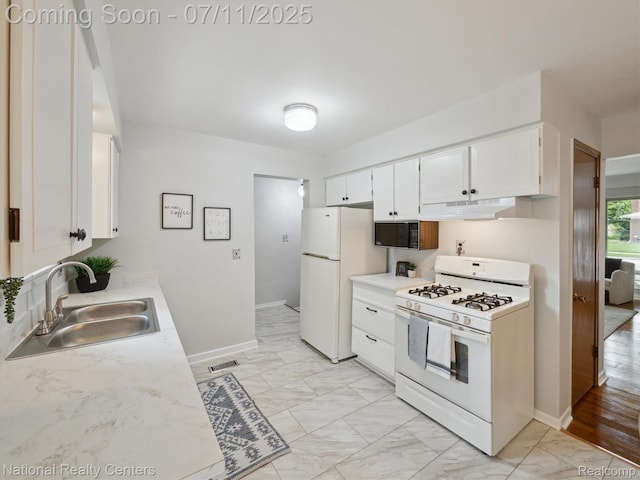 29620 Oakview St, Livonia, MI 48154 - kitchen featuring white appliances, light marble finish flooring, light countertops, and white cabinetry