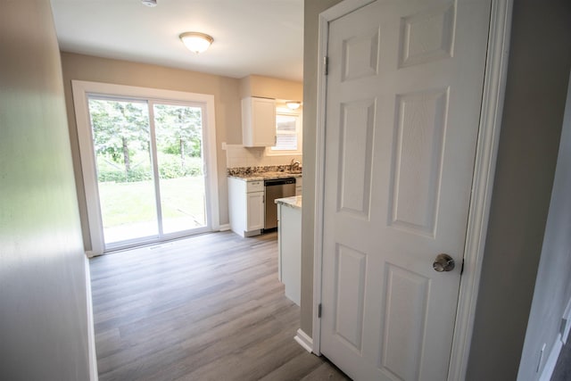 3745 Holly Ave, Flint, MI 48506 - hall featuring light wood-style floors and a sink