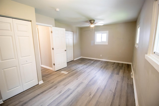 3745 Holly Ave, Flint, MI 48506 - unfurnished bedroom featuring light wood-style floors, a closet, and ceiling fan