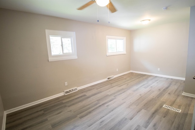 3745 Holly Ave, Flint, MI 48506 - unfurnished room featuring a ceiling fan, wood finished floors, and a smoke detector