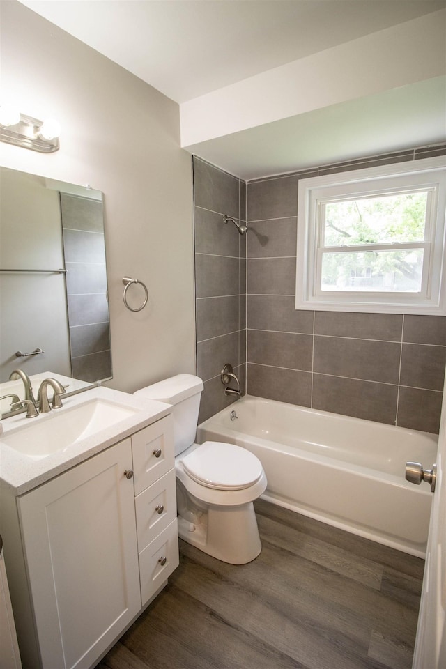 3745 Holly Ave, Flint, MI 48506 - full bathroom with vanity, wood finished floors, and bathing tub / shower combination