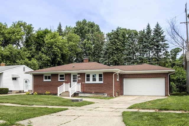 3745 Holly Ave, Flint, MI 48506 - ranch-style home with an attached garage, a chimney, brick siding, a front yard, and driveway