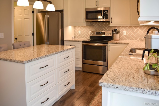 18006 Wingate Dr, Macomb, MI 48042 - kitchen with appliances with stainless steel finishes, tasteful backsplash, and light stone counters