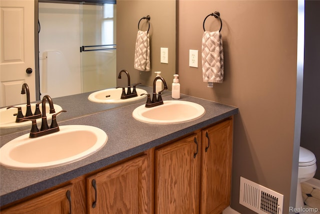 18006 Wingate Dr, Macomb, MI 48042 - bathroom featuring double vanity and toilet