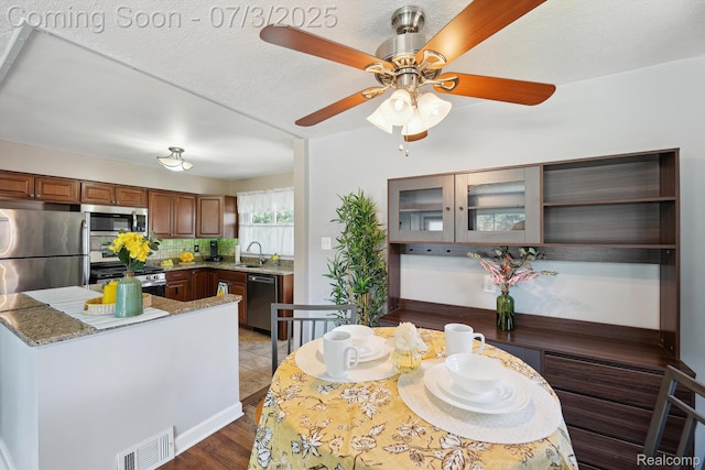 29934 Tamarack Dr, Gibraltar, MI 48134 - dining area featuring a ceiling fan and light wood-style floors