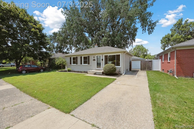 29934 Tamarack Dr, Gibraltar, MI 48134 - view of front facade featuring driveway, a front yard, a chimney, and brick siding