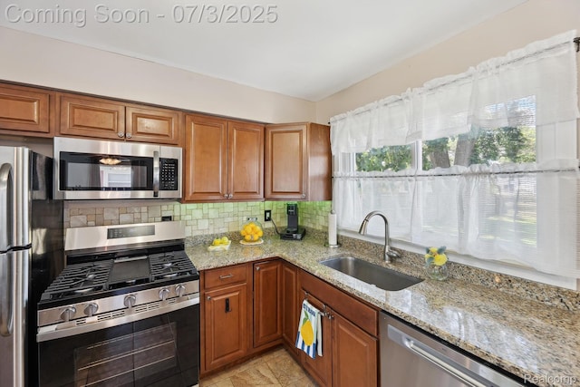 29934 Tamarack Dr, Gibraltar, MI 48134 - kitchen with appliances with stainless steel finishes, light stone countertops, decorative backsplash, and brown cabinets