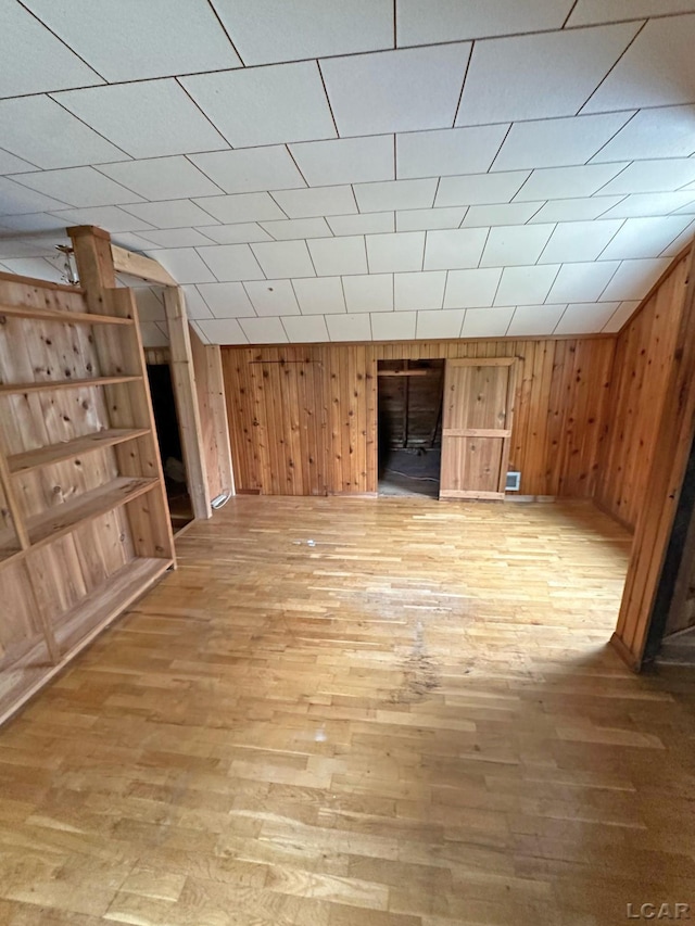 2171 Harold St, Adrian, MI 49221 - unfurnished living room featuring light wood-style flooring and wooden walls