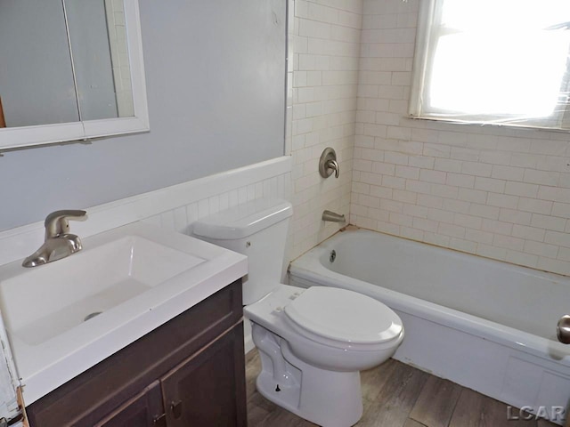 2171 Harold St, Adrian, MI 49221 - bathroom featuring vanity, shower / bathtub combination, and wood finished floors