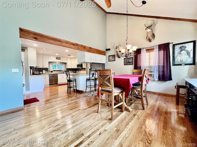 7135 Gardner Line Rd, Lexington, MI 48450 - dining area featuring a chandelier, high vaulted ceiling, and light wood-type flooring