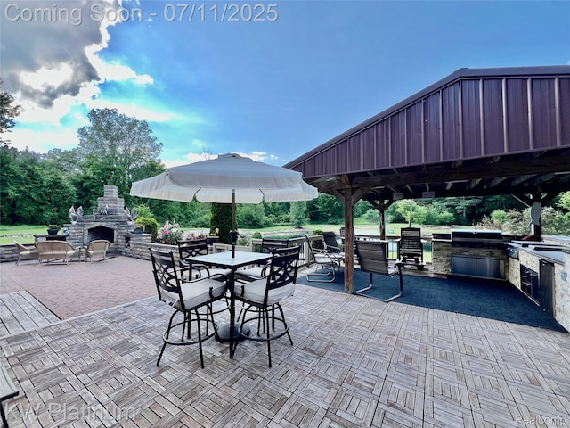 7135 Gardner Line Rd, Lexington, MI 48450 - view of patio featuring an outdoor stone fireplace, exterior kitchen, a gazebo, and outdoor dining area