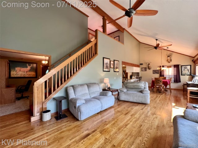 7135 Gardner Line Rd, Lexington, MI 48450 - living area with a ceiling fan, wood finished floors, stairs, high vaulted ceiling, and beamed ceiling
