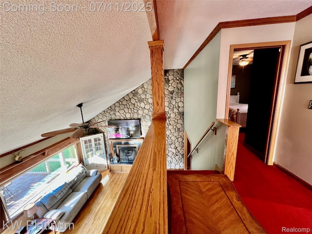 7135 Gardner Line Rd, Lexington, MI 48450 - stairway featuring ceiling fan, a textured ceiling, and vaulted ceiling
