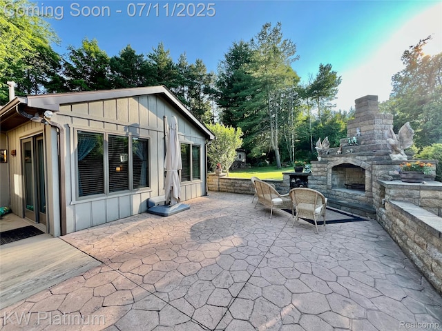 7135 Gardner Line Rd, Lexington, MI 48450 - view of patio / terrace featuring an outdoor stone fireplace