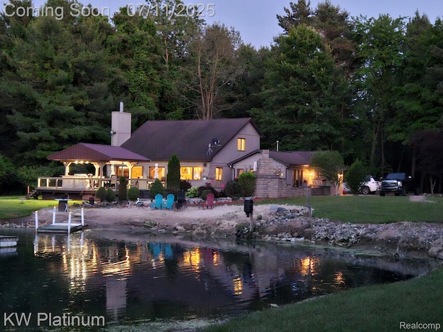 7135 Gardner Line Rd, Lexington, MI 48450 - rear view of property with a chimney and a yard