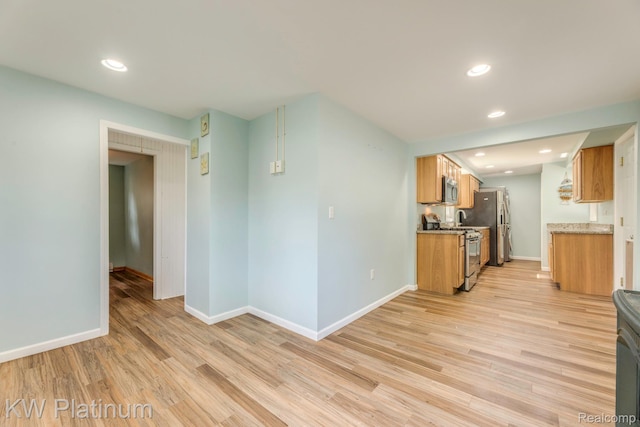 7377 Dogwood Rd, Lexington, MI 48450 - kitchen with stainless steel appliances, light wood-type flooring, recessed lighting, and brown cabinets
