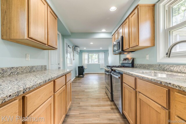 7377 Dogwood Rd, Lexington, MI 48450 - kitchen featuring light wood-style flooring, stainless steel appliances, recessed lighting, and light stone countertops
