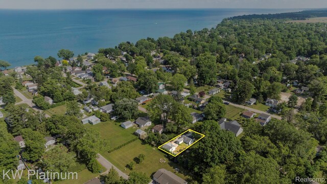 7377 Dogwood Rd, Lexington, MI 48450 - aerial view of property and surrounding area with property boundaries highlighted, a large body of water, and nearby suburban area
