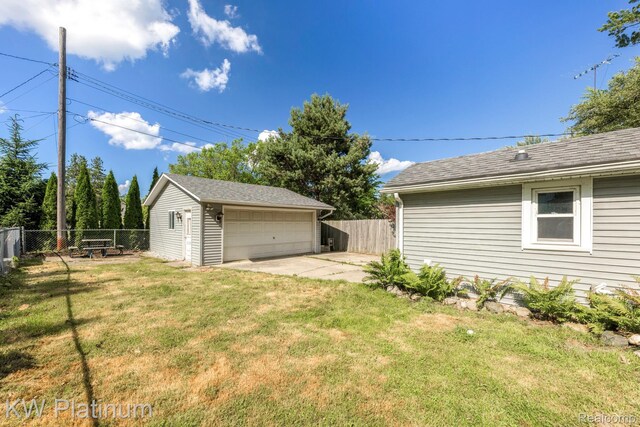 7377 Dogwood Rd, Lexington, MI 48450 - fenced backyard with a detached garage and an outbuilding