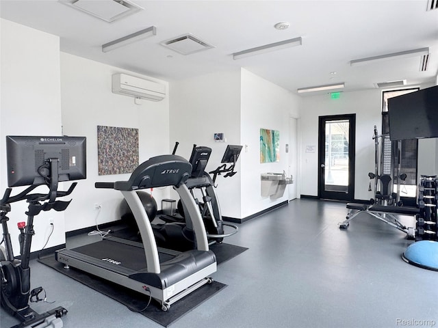 750 Forest Ave Unit 202, Birmingham, MI 48009 - exercise room featuring baseboards and an AC wall unit
