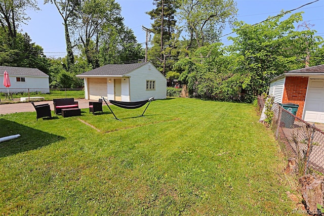 24271 Westhampton St, Oak Park, MI 48237 - view of yard with a detached garage and an outbuilding