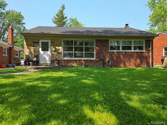 24271 Westhampton St, Oak Park, MI 48237 - view of front of home with a front lawn, brick siding, a chimney, and roof with shingles